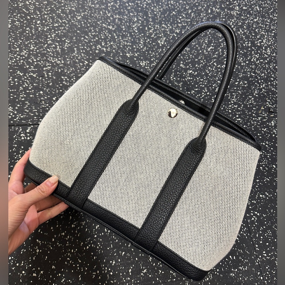 Women top handbag. Canvas with leather
